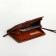 Male purse-clate on a zipper, brown color