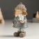 Souvenir Polystone "Baby in a coat with a gift" costs 5x4.5x11 cm