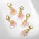 Charm "fruit", pink color in gold