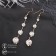 Hanging earrings with rhinestones "Drop" path, white color in gold, 6.2 cm
