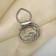 Clip for the scarf "pearl curl", the color is white in matte silver