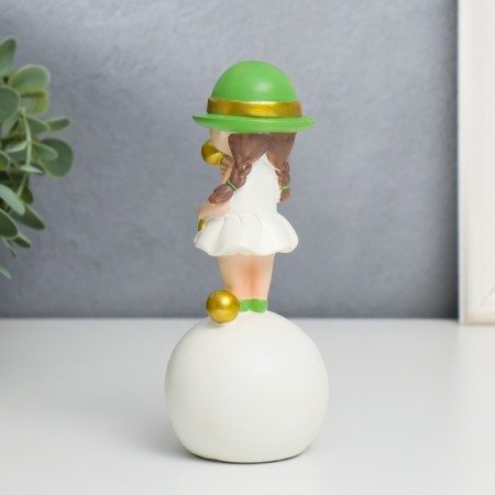 Souvenir Polystone "Baby in a green hat, with a gold bubble on the ball" 16x7x7 cm-1