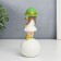 Souvenir Polystone "Baby in a green hat, with a gold bubble on the ball" 16x7x7 cm