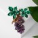 Brooch "Amethyst" grapes, mobile beads, green-violet color in gold