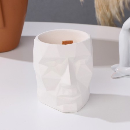 A candle made of soy wax in the kashpo "Geometric head", 9x7.5 cm, white