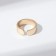 A ring with the inscription "Happiness", the color is gold, dimensionless