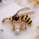 Brooch "Bee" with bead, color in gold