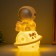 Lamp "Cosmonaut with a book on Saturn" 2W LED LR44 5x8x13cm