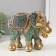 Souvenir Polystone "Elephant with an elephant, chamomile on the ass" red-blue, sparkle 17x10x15 cm 10325