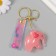 A plastic keychain with a carbine, a pink elephant strap 2.5x5.3x4.5 cm