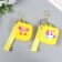 A keychain wallet with a carbine silicone "Bright pictures" Square yellow mix 6x3x7 cm
