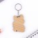 A wooden key key "Corgi with avocado", 4.4 x 6.4 cm