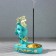 Caus -face "face", turquoise