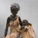 Souvenir Polystone "African with a child" under a tree 18.5x17.5x10.5 cm