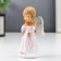 Souvenir Polystone "Angel-Land-Prayer" White-pink 9.5x4.5x5 cm