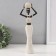 Polystone souvenir "African with a wicker round jug" white 10x6x28 cm
