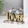 Polystone souvenir "Two eagle owls on the letters. Love" 3.8x11.5x8.5 cm