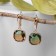 Earrings with “Illusion” rhinestones, a smooth square, brown-green color in gold