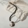 A decorative-based pendant-based pendant, black and white color in gold, l = 40 cm