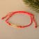 Bracelet "New Year" infinity, red color with gold