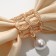 The cloak for a scarf "Four Liber" with bead, the color is white in pink gold