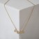 Pendant "legs", color gold, l = 46 cm