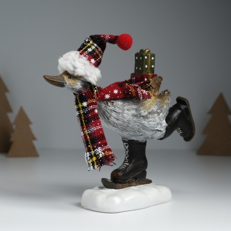 Polystone souvenir "Goose in a cap, knitted scarf, on mini-covers, with gifts" 6.5x19.5x17 cm 10325