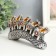 Polystone souvenir "Five elephants on a tusk with flowers" silver 17x4x8 cm