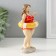Polystone souvenir "Pill in a striped swimsuit with an inflatable circle" 9x6.5x15.5 cm