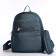 A backpack with a zipper, 5 outer pockets, pencil case, turquoise color