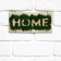 The keyrean is wall -mounted with moss "Home".