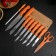 A set of kitchen knives on a stand, 8 knives, knife, scissors, orange color