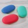 Body sponge with a massage layer, color mix