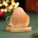 Souvenir "pleasant surprises! 2025", with a bell, selenite, 6x6x4.5 cm