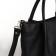 The bag is female, medium size, long belt, black color