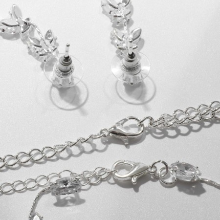 Set 4 objects: earrings, necklaces, bracelet, skewers ring triliary, white color in silver-1