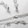 Set 4 objects: earrings, necklaces, bracelet, skewers ring triliary, white color in silver