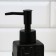 A dispenser for liquid soap with a sponge and a brush for dishes, black, 16 x 12 x 4 cm.