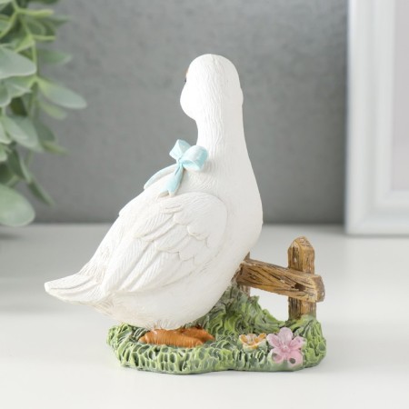 Polystone souvenir "Gusenok with a blue bow at the fence" 9x8x10 cm-2