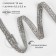 Rhinestones and beads are thermoclayes, width - 10 mm, 4.5 ± 0.5 m, silver color