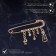 Pin "Classic" notes, 5.5 cm, white-black color in gold