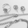 Set 4 objects: earrings, necklaces, bracelet, ring "grace" circles, white color in silver