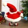Interior doll "Grandfather Frost in red caftan and cap with snowflakes" 44x21x31 cm