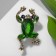 Brooch "Frog" precious, white-green color in black gold