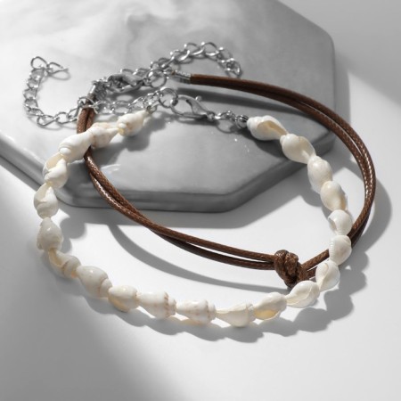 Bracelets on the leg "shells", white-brown color in silver