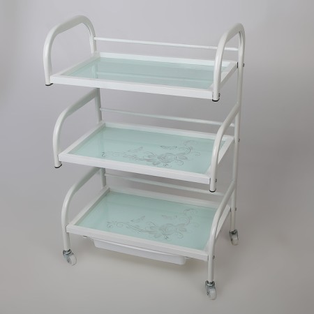 Cosmetologist table 52 × 32 × 80, on wheels ×, 3 shelves, white color (pattern on the glass of mix)