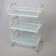 Cosmetologist table 52 × 32 × 80, on wheels ×, 3 shelves, white color (pattern on the glass of mix)