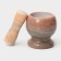 A mortar with a “marble” push, made of natural stone, brown color