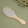 Massage comb, 22 × 7 cm, beige/blue color