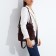 Women's backpack made of artificial leather with lightning, 2 pockets, burgundy color
